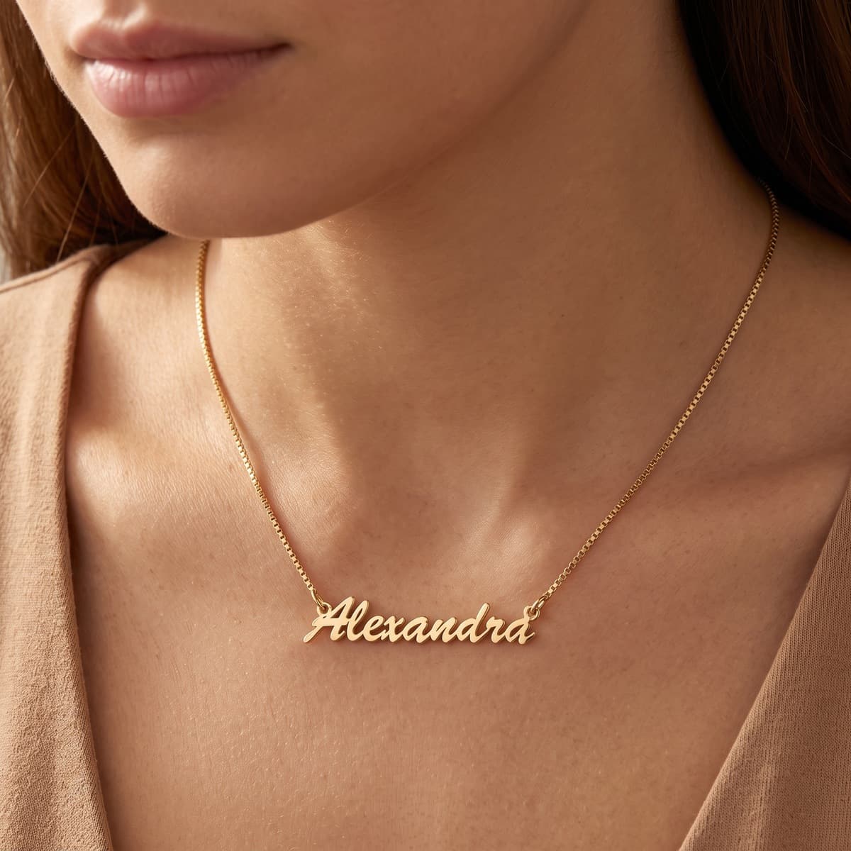 Macro of a personalized name necklace with a long clearly readable engraved name